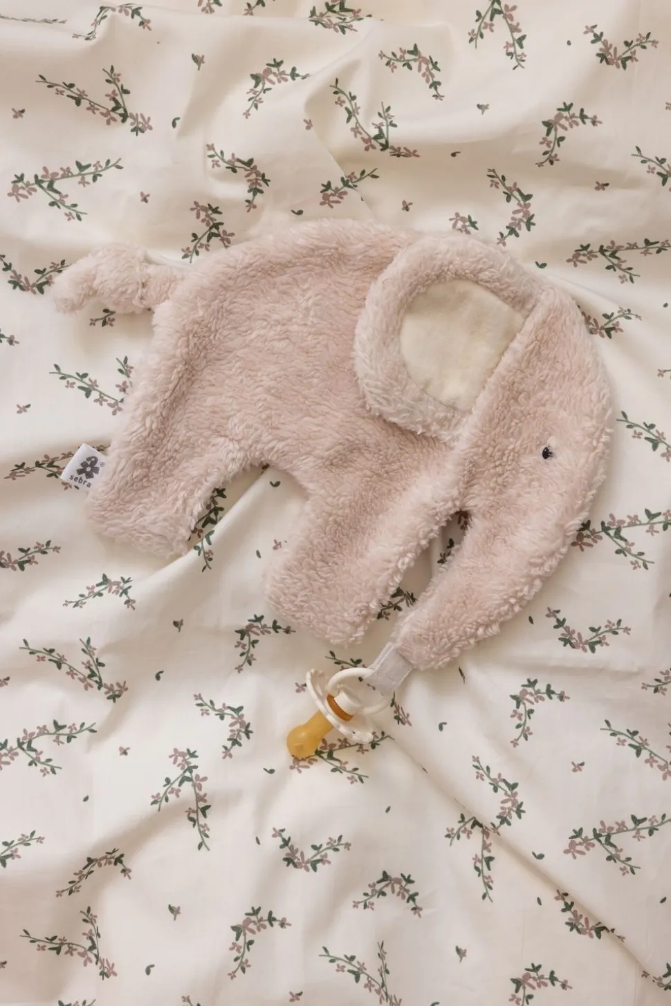 Cuddle cloth with pacifier holder
